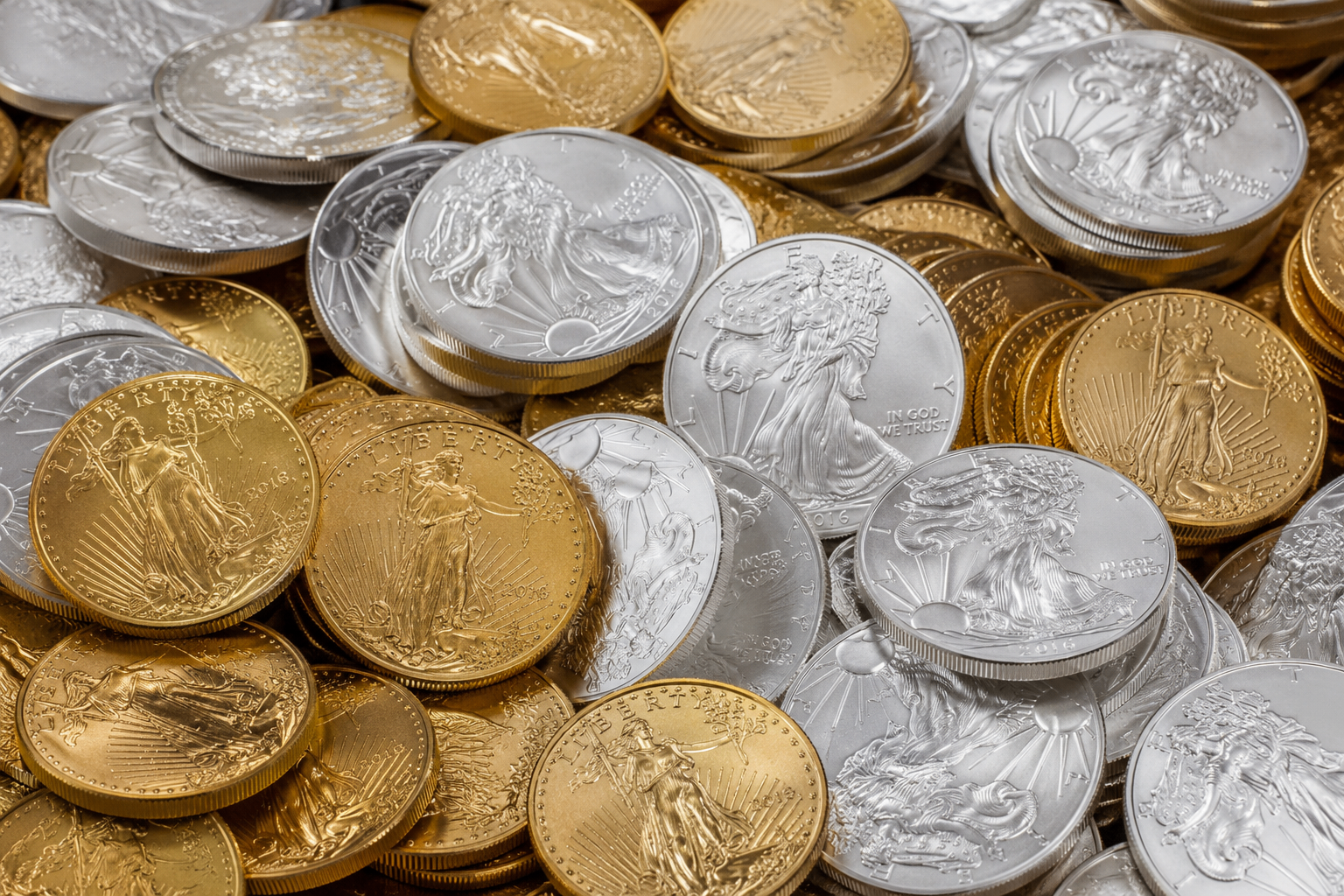 A treasure of gold and silver coins — real precious metal gifts from GIVGOLD